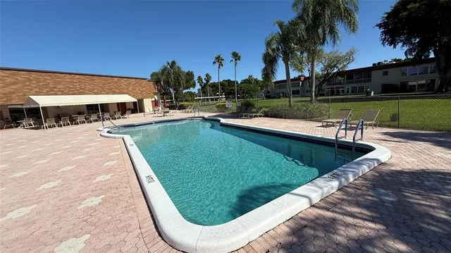 a view of a swimming pool with a patio