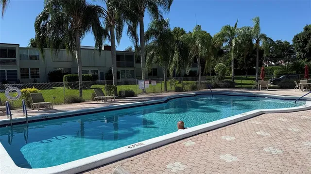 a view of a house with roof deck and sitting area