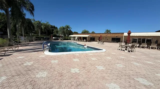 a view of a house with swimming pool