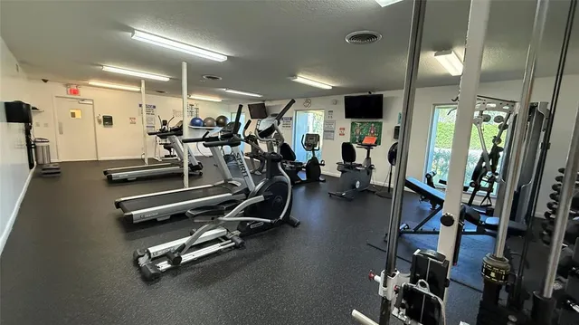 a view of a backyard with table and chairs and potted plants