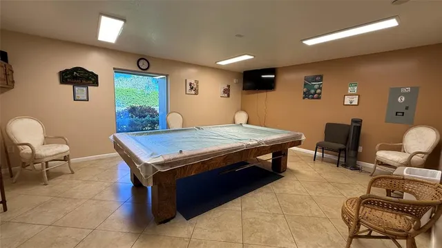 a view of house with backyard porch and sitting area