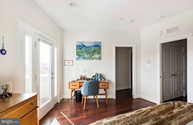 a workspace with furniture and window