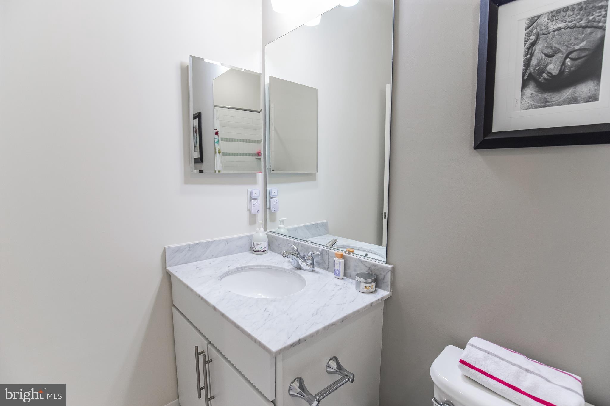1904 Vermont Avenue Northwest, Unit B Washington, DC 20001 - Photo 19 of 26 a bathroom with a sink and a mirror