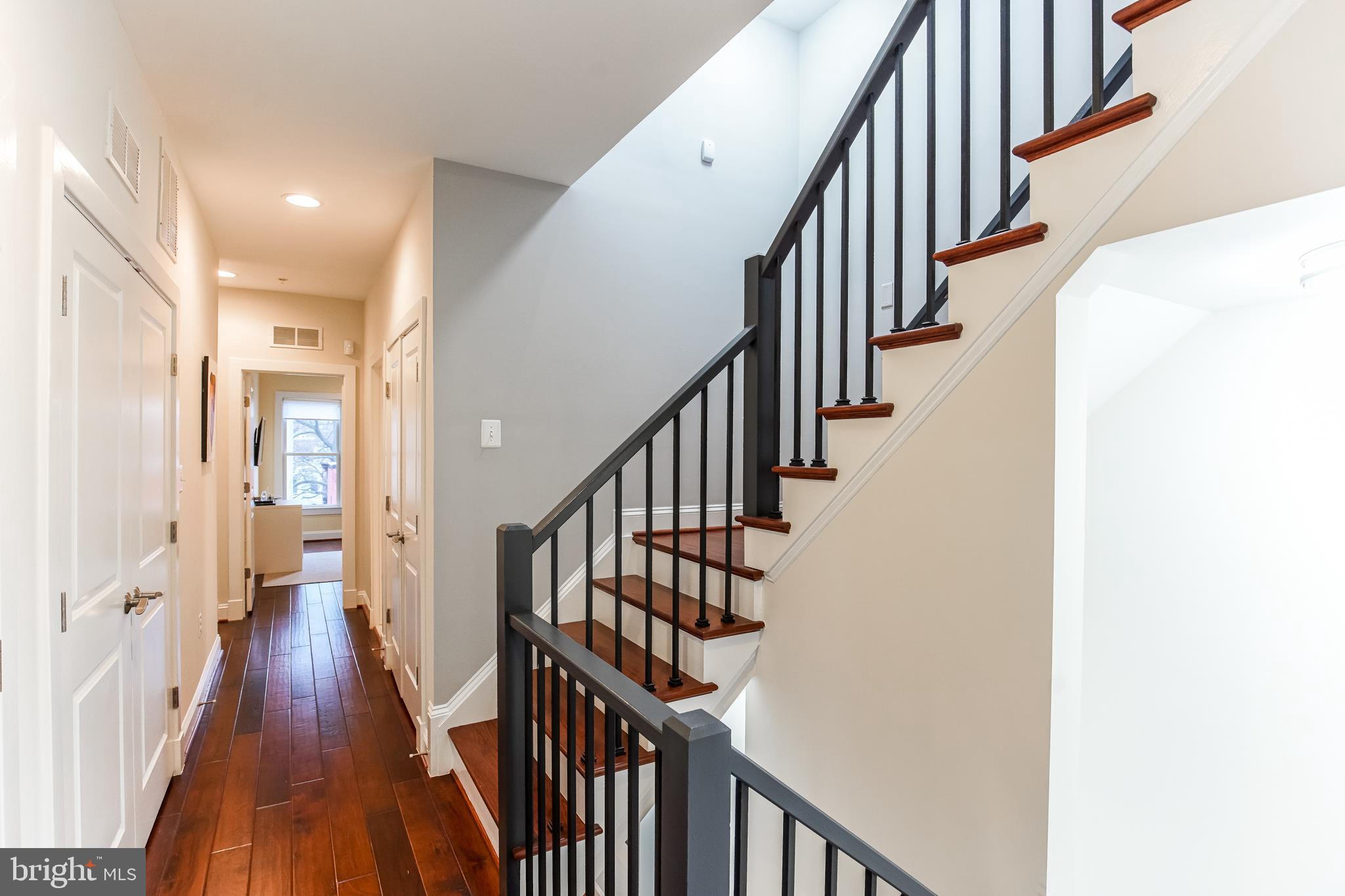 1904 Vermont Avenue Northwest, Unit B Washington, DC 20001 - Photo 20 of 26 a view of staircase with wooden floor and white walls