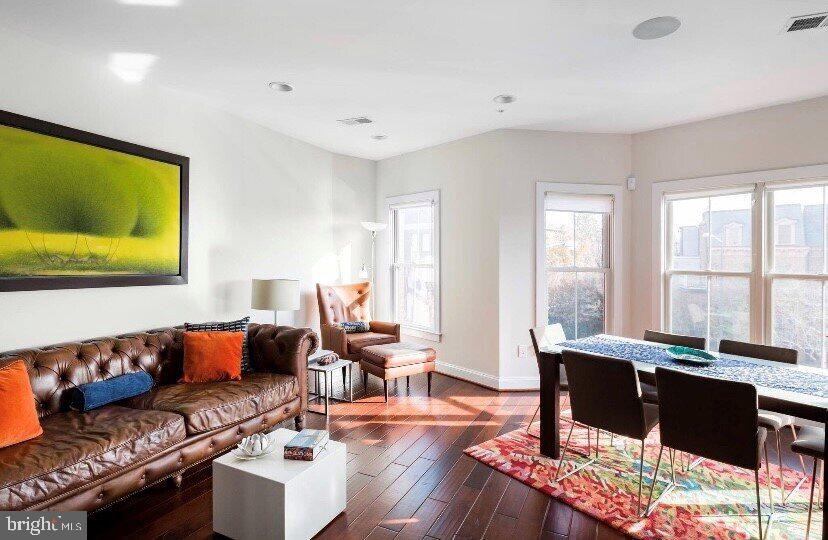 1904 Vermont Avenue Northwest, Unit B Washington, DC 20001 - Photo 3 of 26 a living room with furniture and a large window