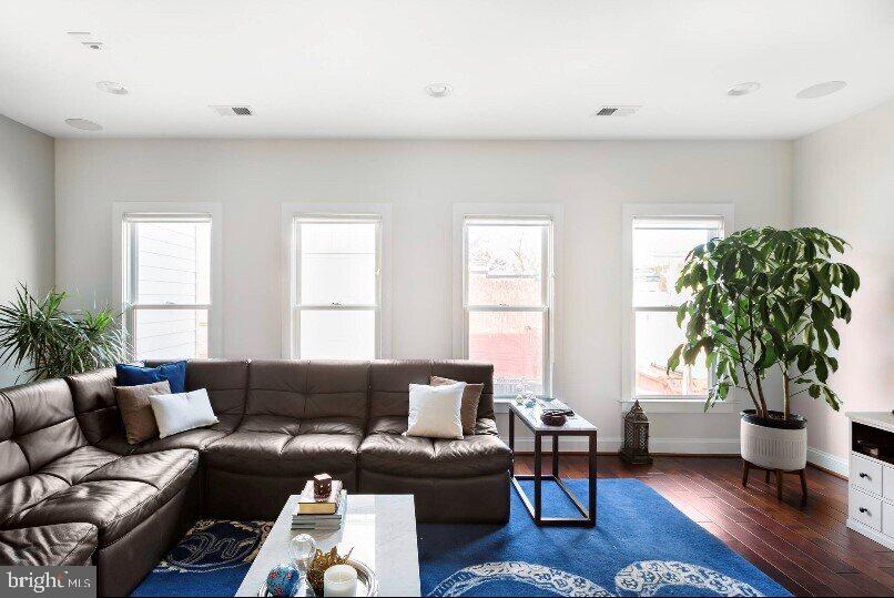 1904 Vermont Avenue Northwest, Unit B Washington, DC 20001 - Photo 6 of 26 a living room with furniture potted plant and a window