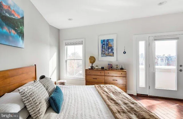 a bed room with a bed and a window