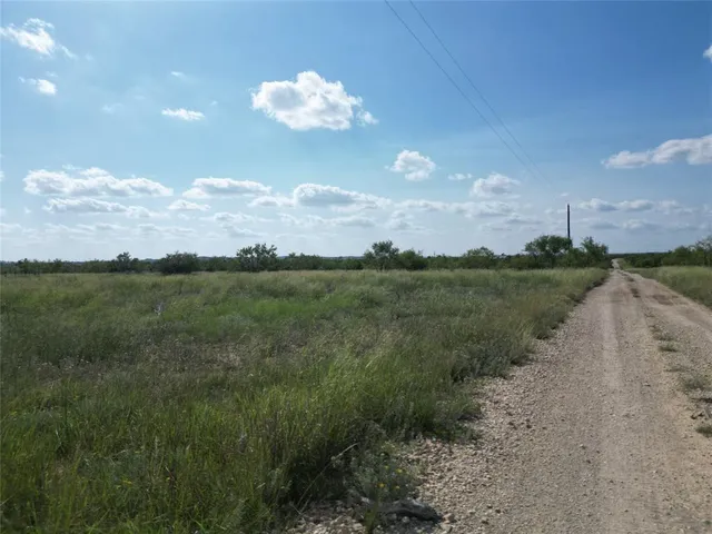 a view of a lake with a yard