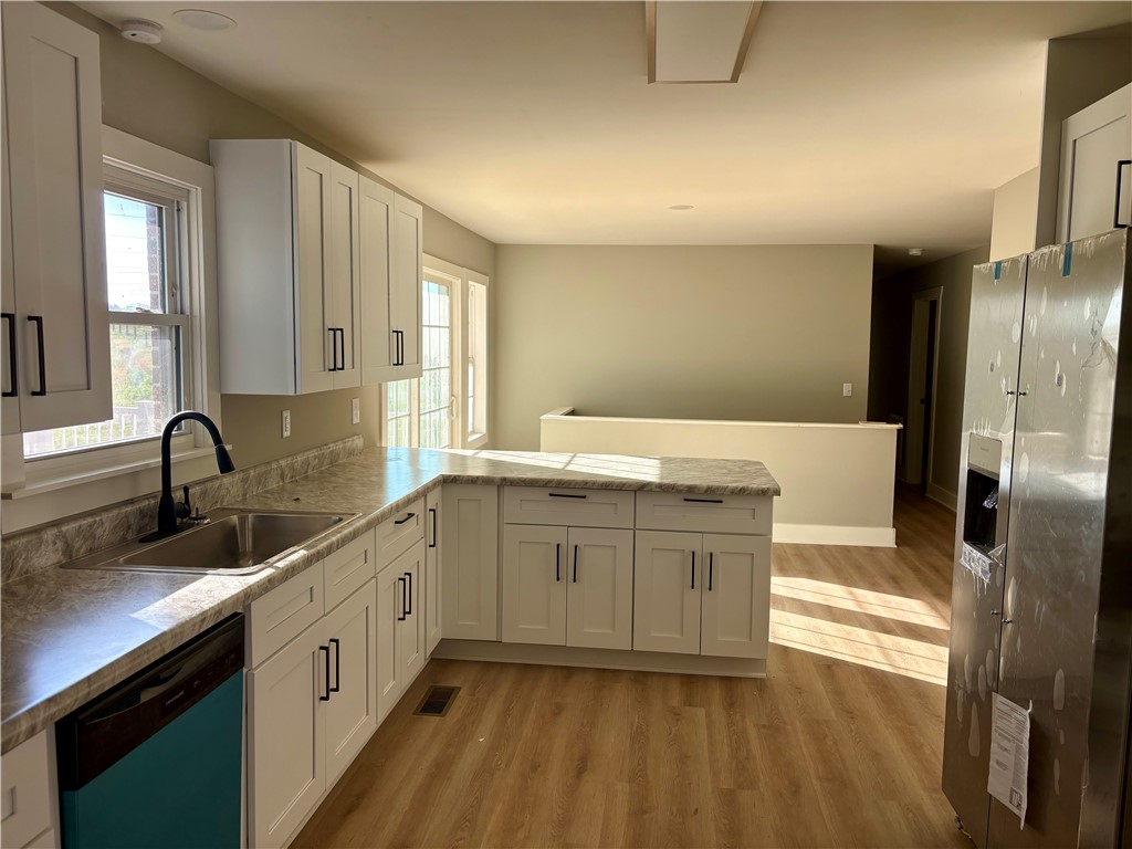 351 Randys Road Westminster, SC 29693 - Photo 12 of 30 A well-lit kitchen with sleek cabinetry, a functional island, and contemporary appliances awaits.