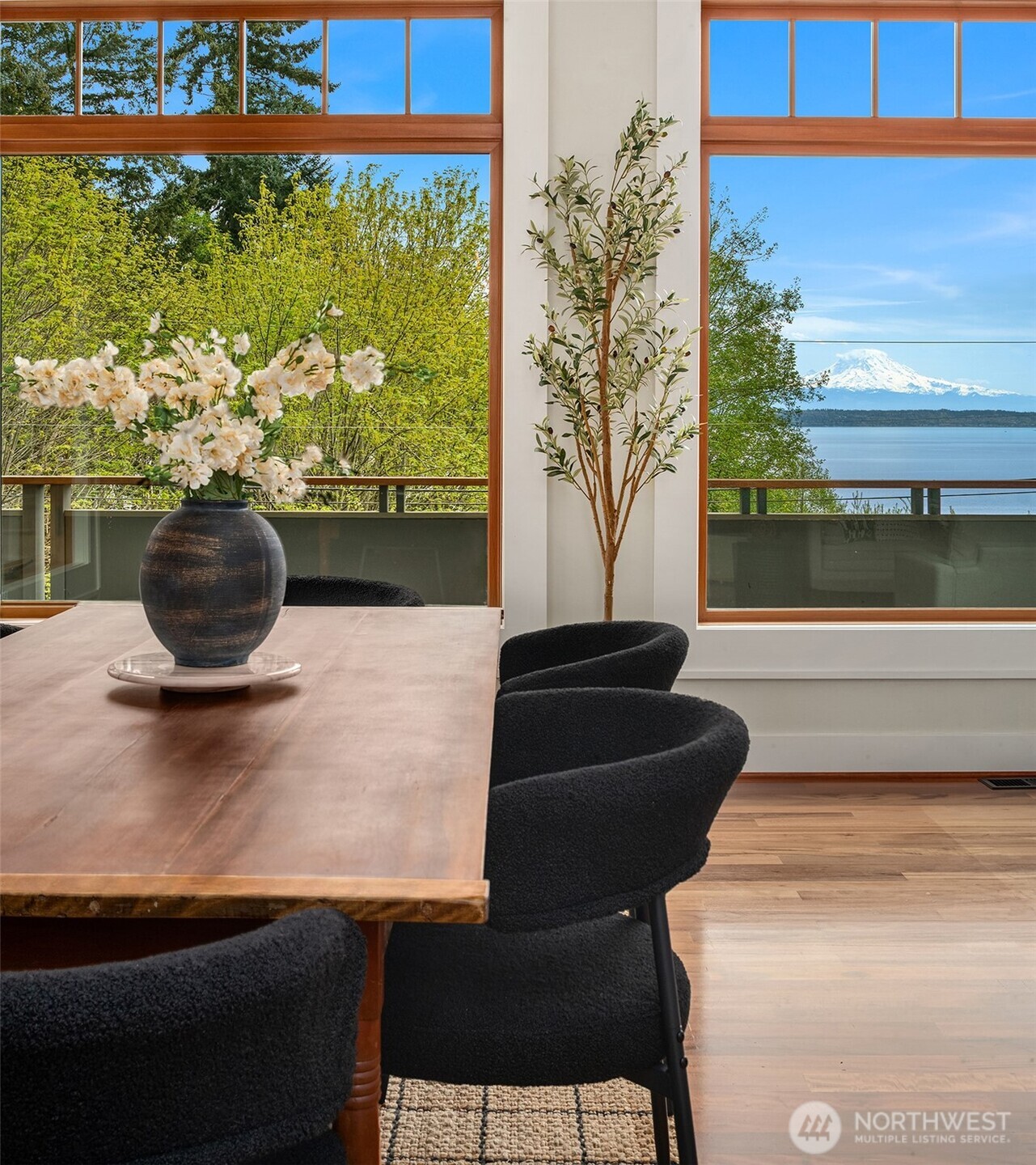 8302 Southwest Dilworth Road Vashon, WA 98070 - Photo 10 of 40 a living room with a fireplace and a potted plant
