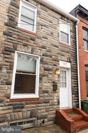 a front view of a house with stairs