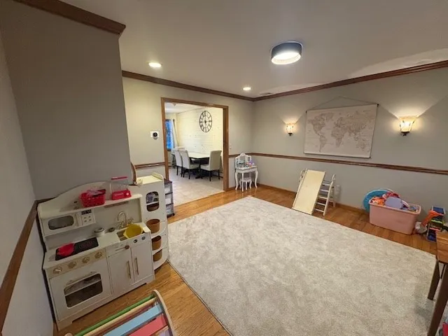 a bedroom with furniture and a book shelf