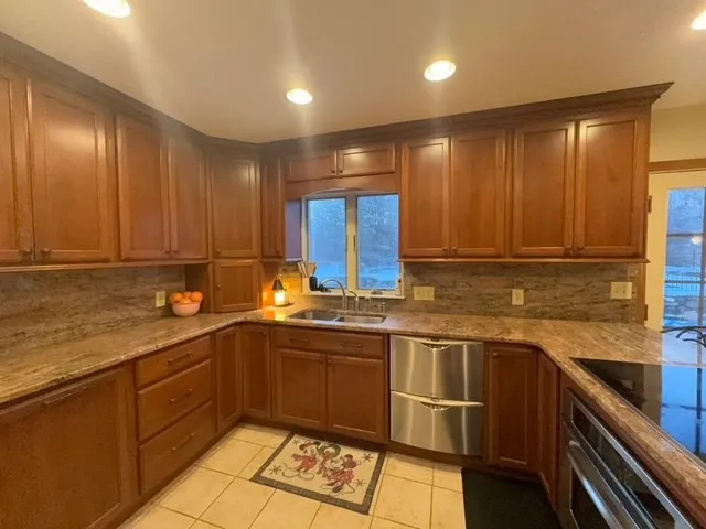 a kitchen with a sink and cabinets