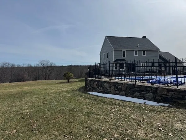 a metallic refrigerator freezer sitting inside of a kitchen
