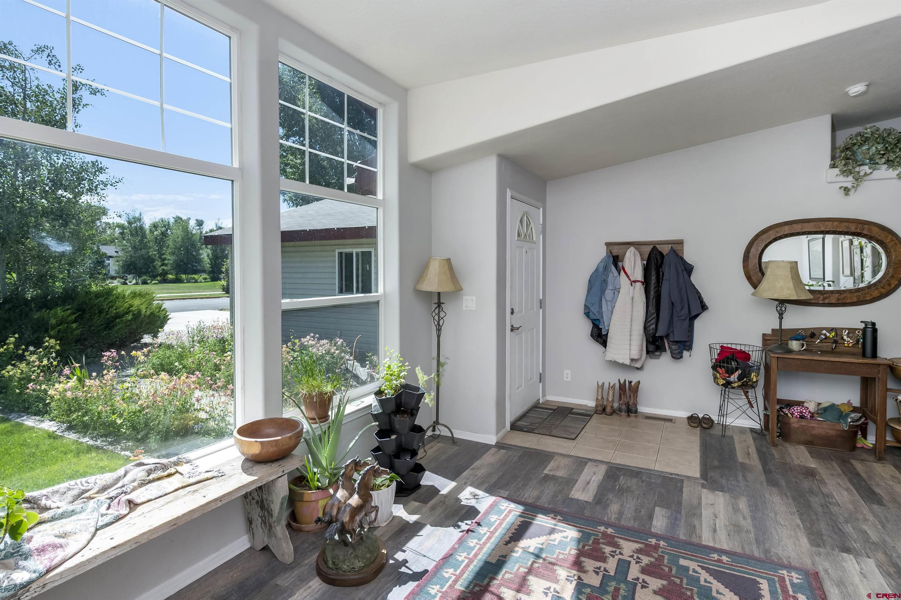 351 North 3rd Street Gunnison, CO 81230 - Photo 17 of 45 a table and chairs in front of a window
