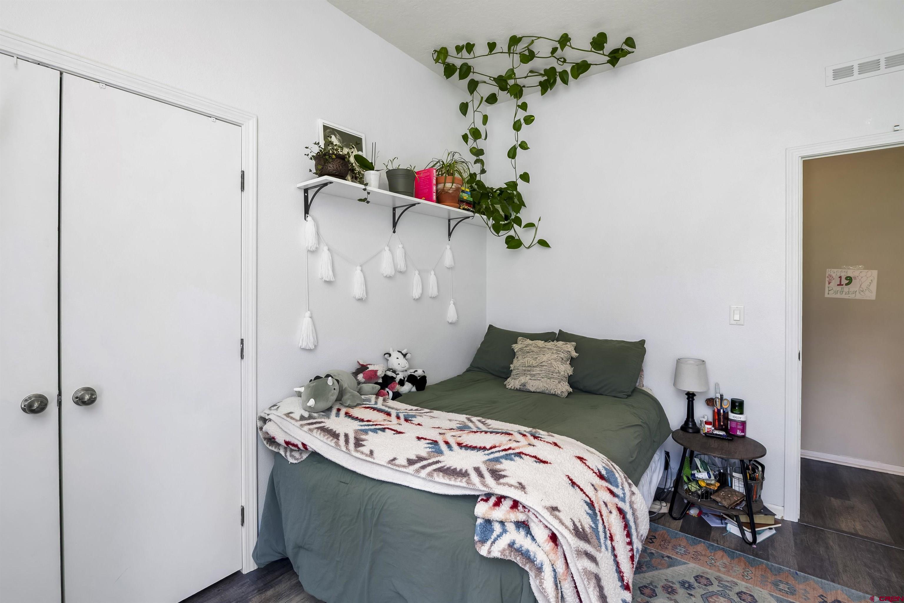 351 North 3rd Street Gunnison, CO 81230 - Photo 31 of 45 a bedroom with a bed and a dresser