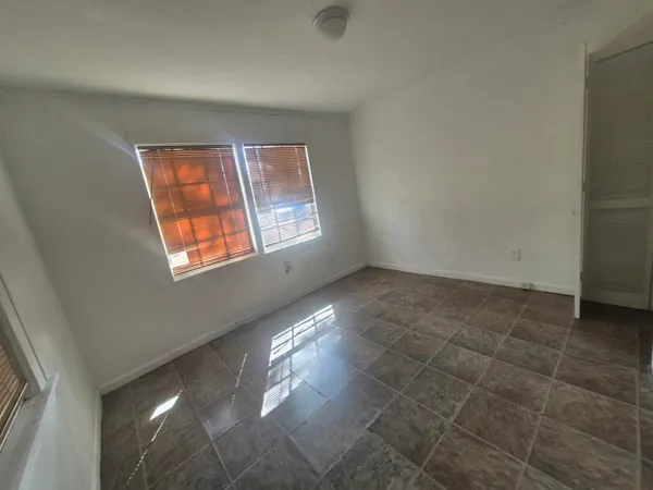 an empty room with windows