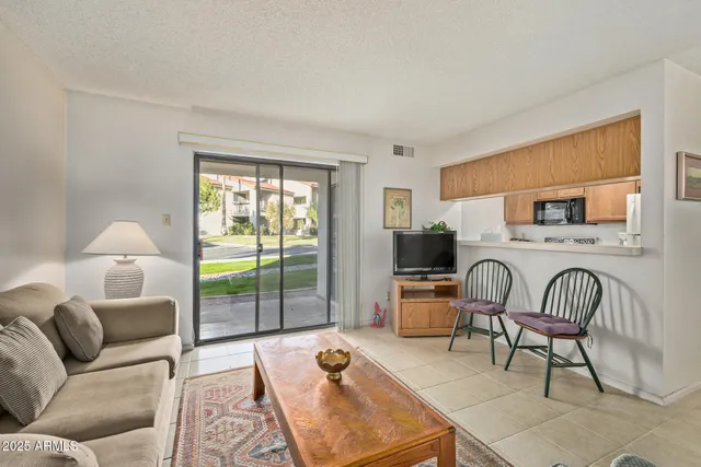 a living room with furniture and a window