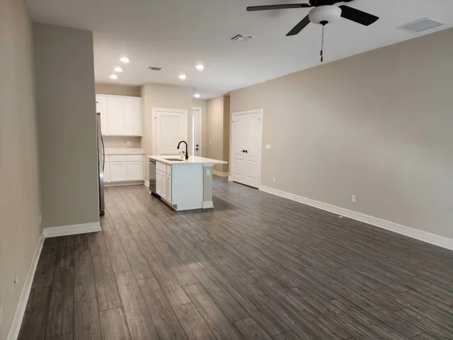 a view of kitchen with wooden floor