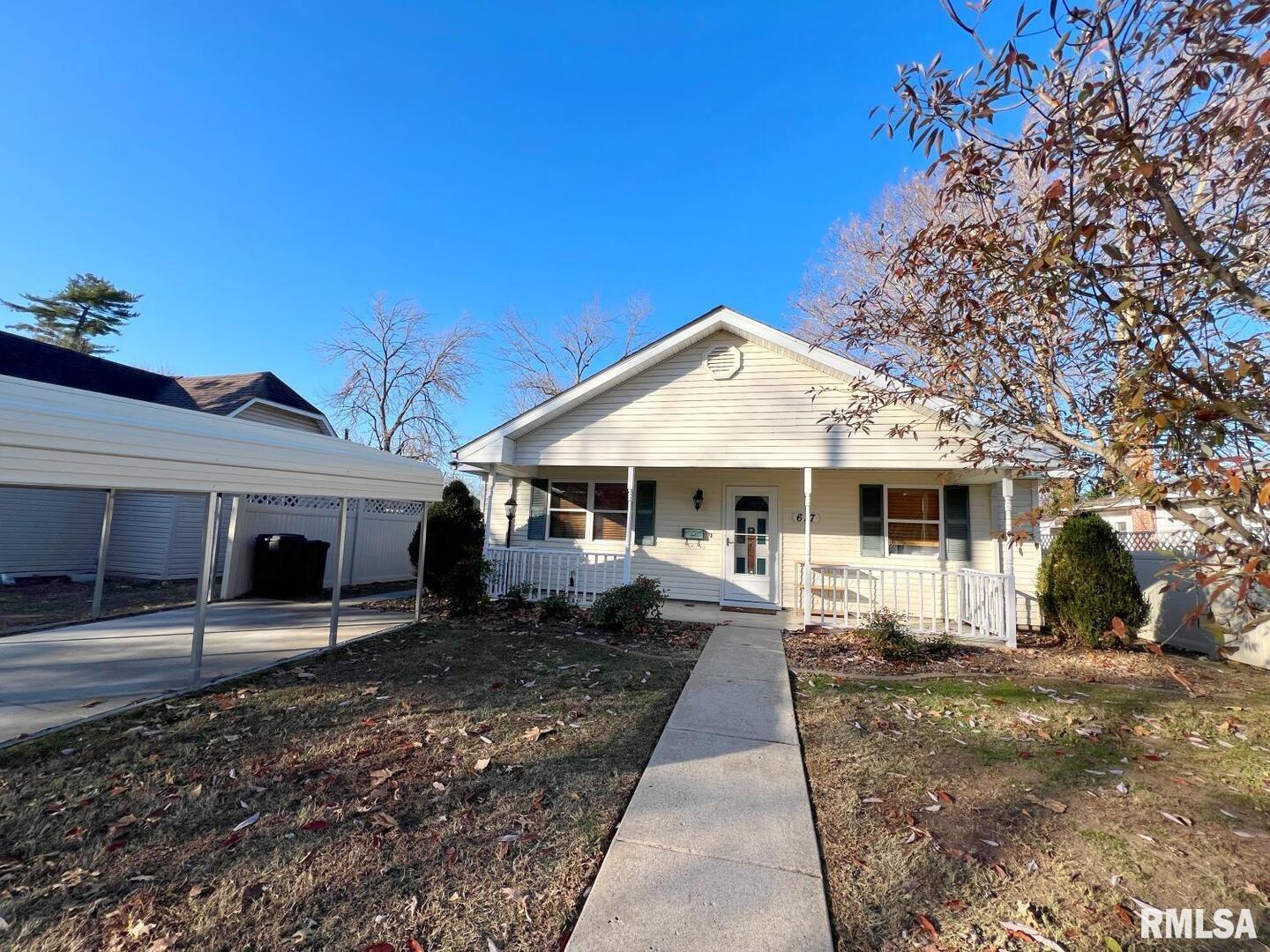 617 North 10th Street Herrin, IL 62948 - Photo 20 of 22 a front view of a house with a yard