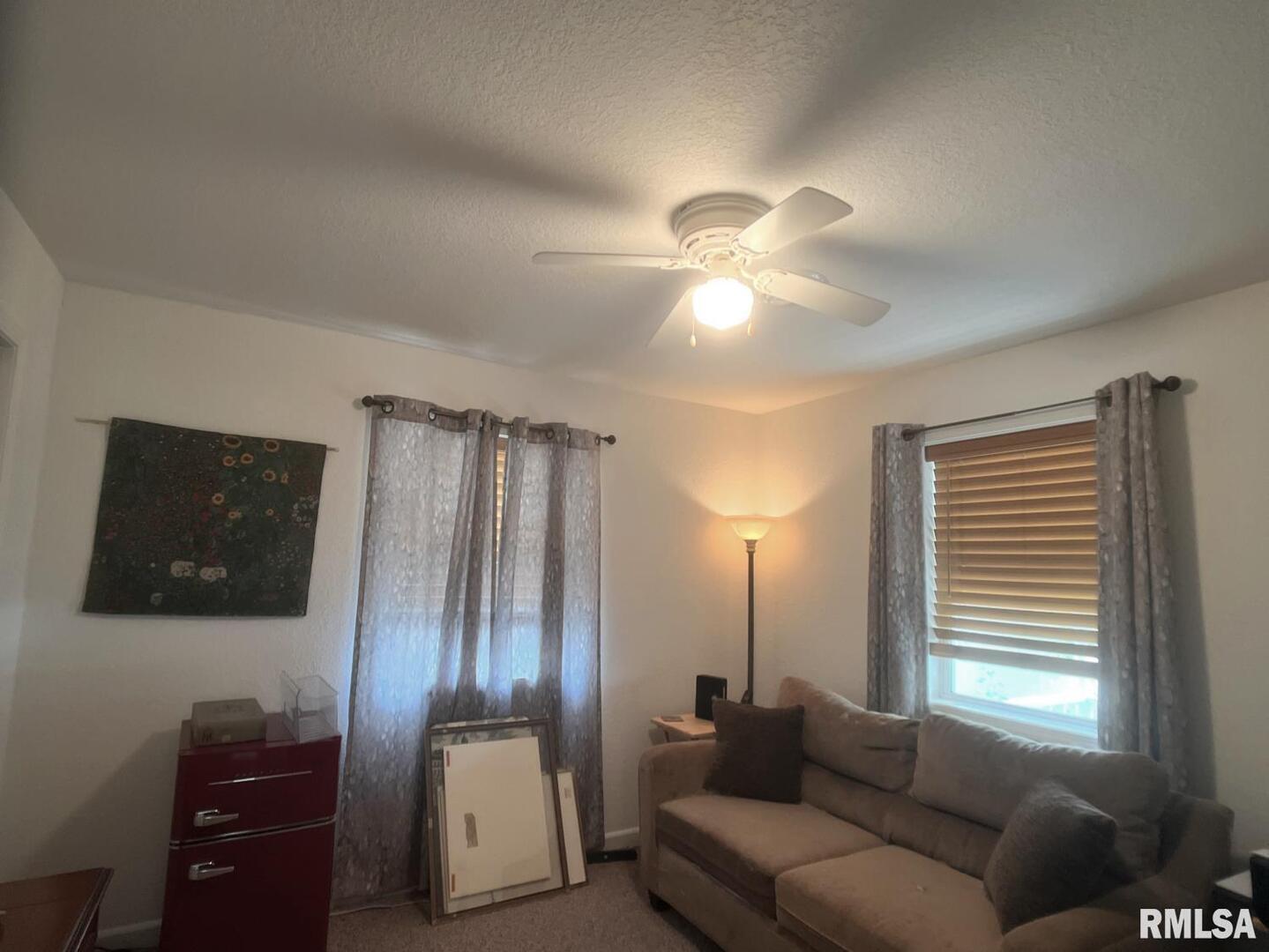 617 North 10th Street Herrin, IL 62948 - Photo 7 of 22 a living room with furniture and a flat screen tv
