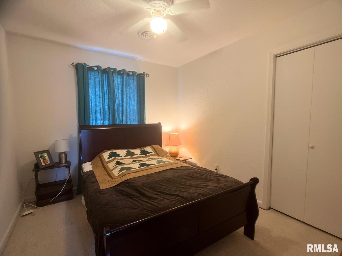 617 North 10th Street Herrin, IL 62948 - Photo 9 of 22 a bedroom with a bed and a dresser