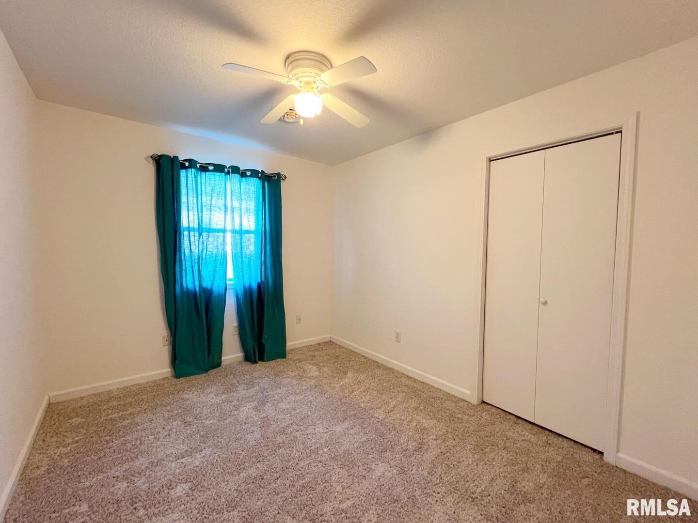 617 North 10th Street Herrin, IL 62948 - Photo 10 of 22 an empty room with closet and a window