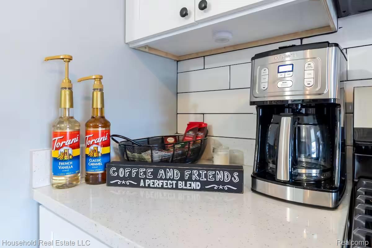 4446 Commonwealth Street Detroit, MI 48208 - Photo 20 of 28 Kitchen view of white cabinetry and light stone counters