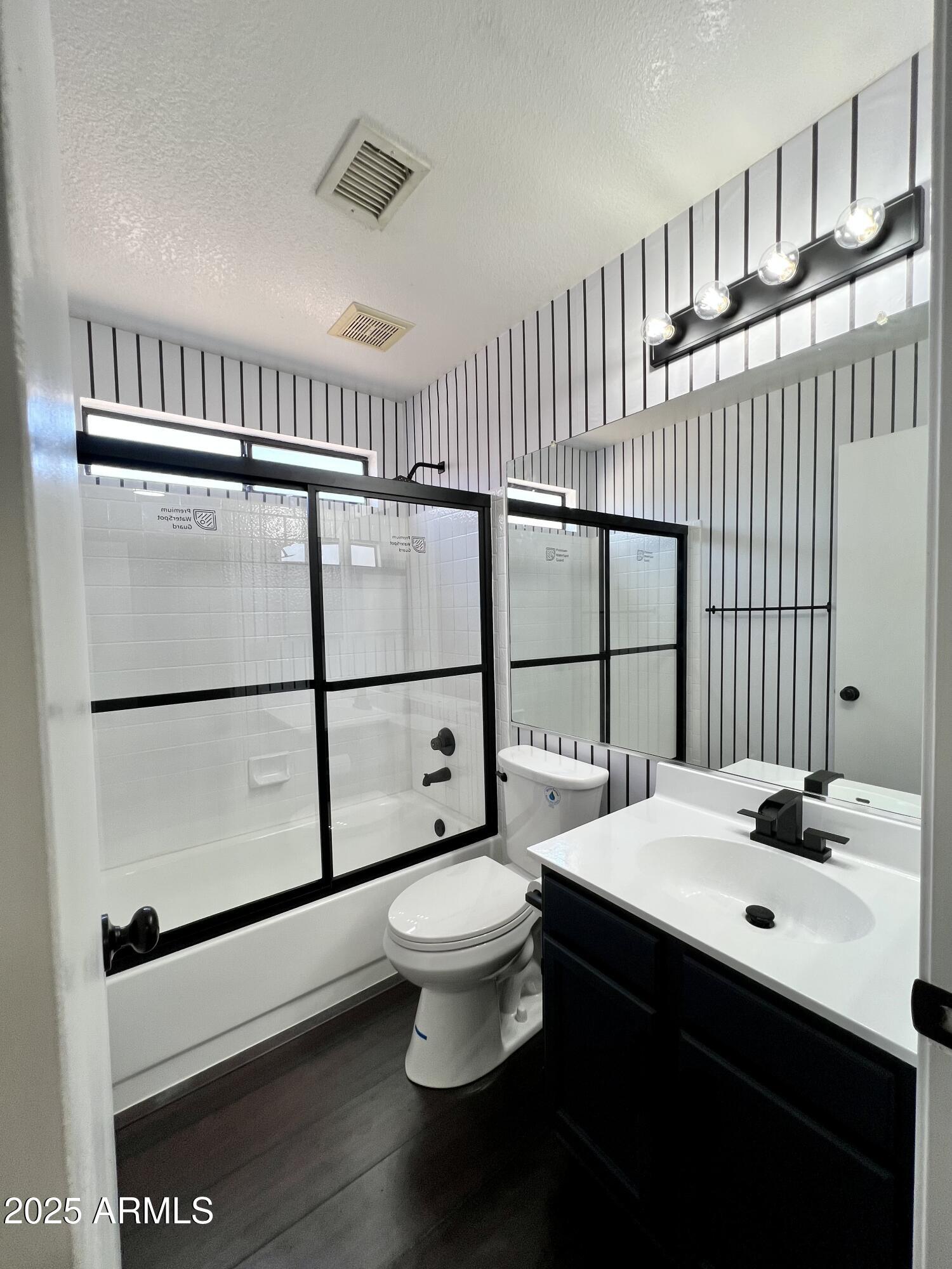 13643 South 36th Way Phoenix, AZ 85044 - Photo 11 of 32 a bathroom with a sink toilet and shower