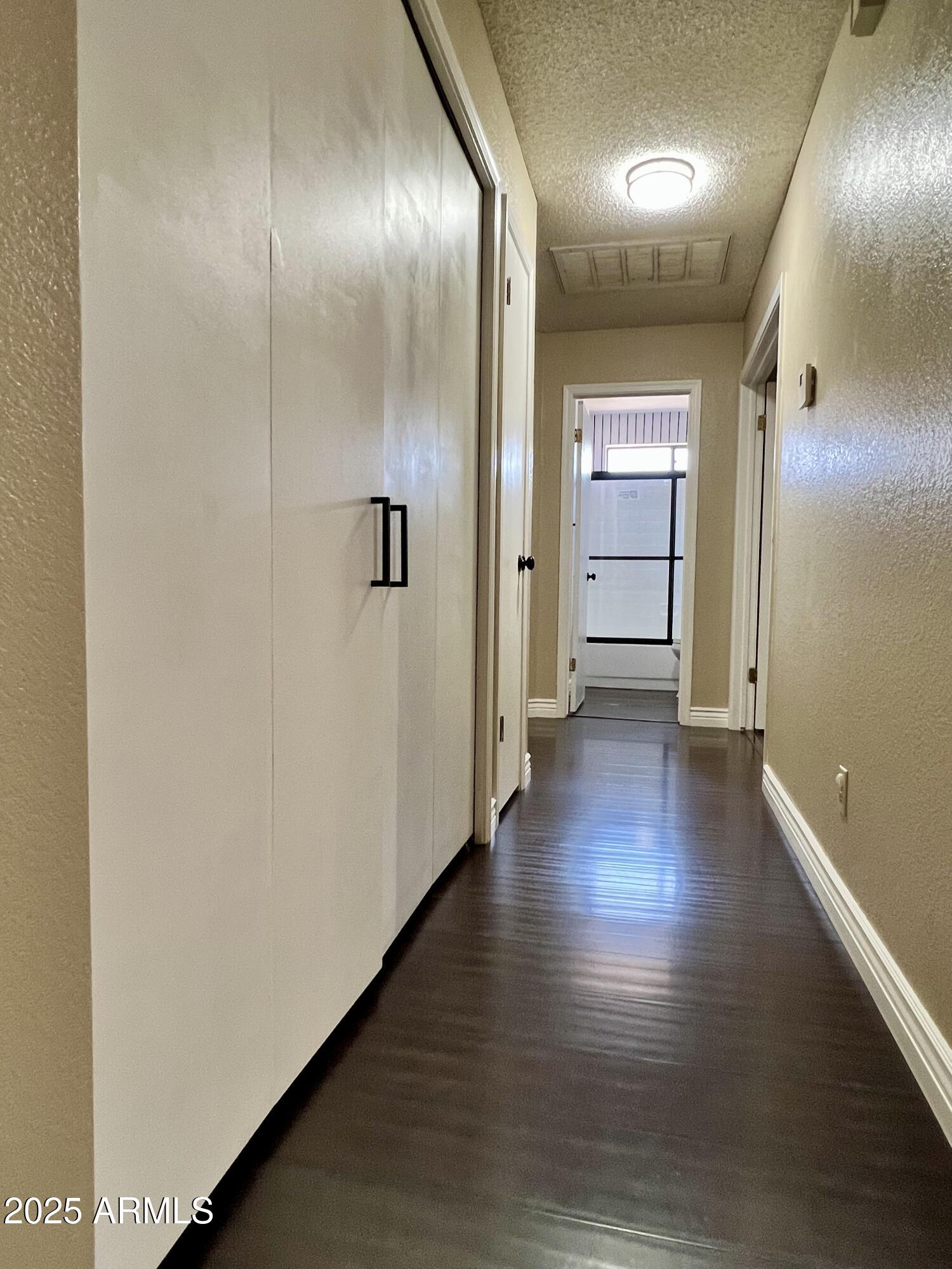 13643 South 36th Way Phoenix, AZ 85044 - Photo 12 of 32 an empty room with wooden floor