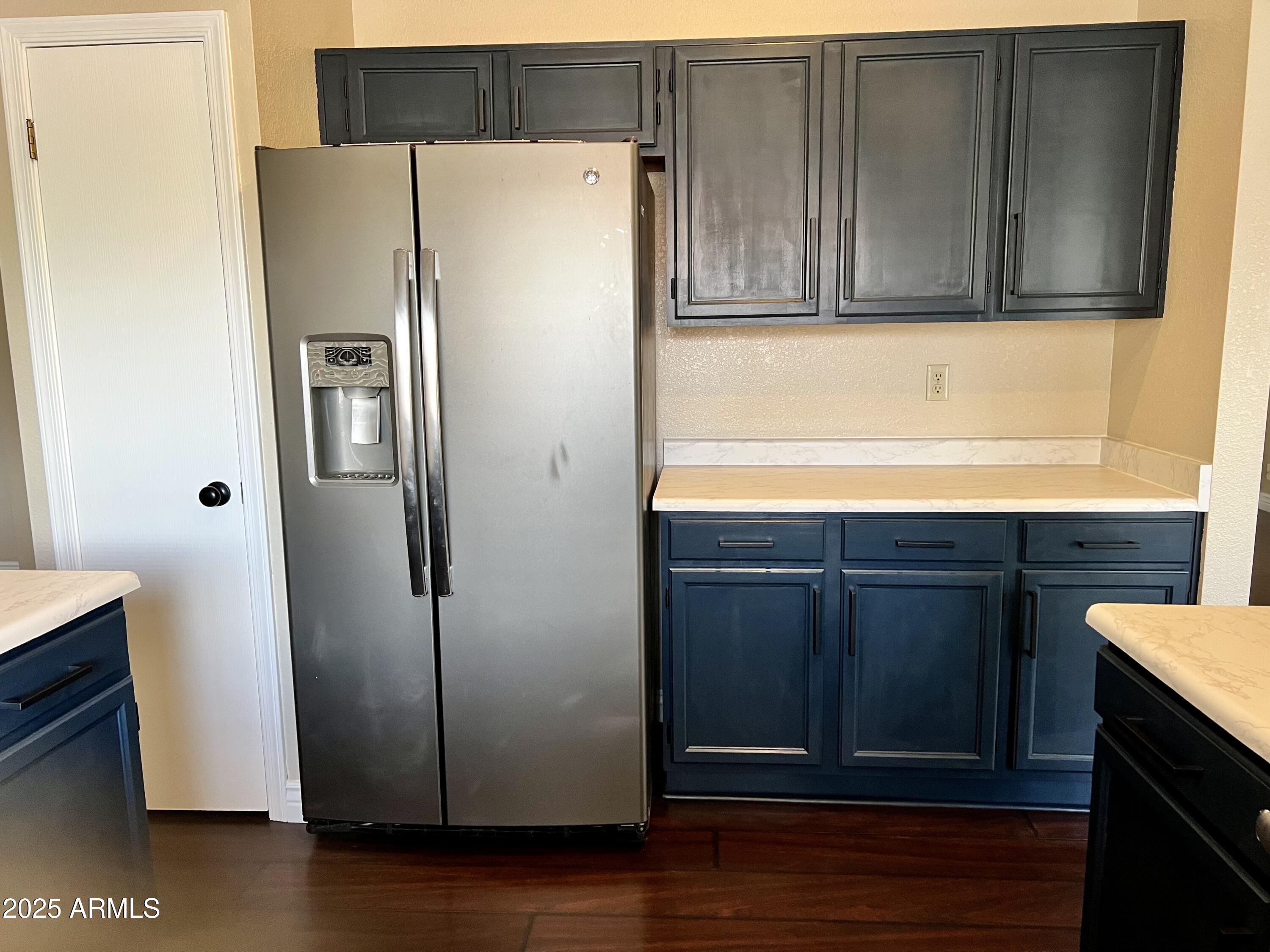 13643 South 36th Way Phoenix, AZ 85044 - Photo 5 of 32 a white refrigerator freezer sitting inside of a kitchen
