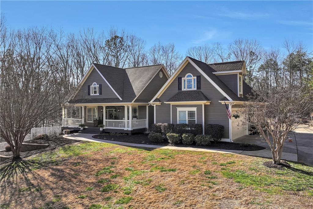 321 Chumbley Road Dawsonville, GA 30534 - Photo 65 of 65 a front view of a house with yard and trees