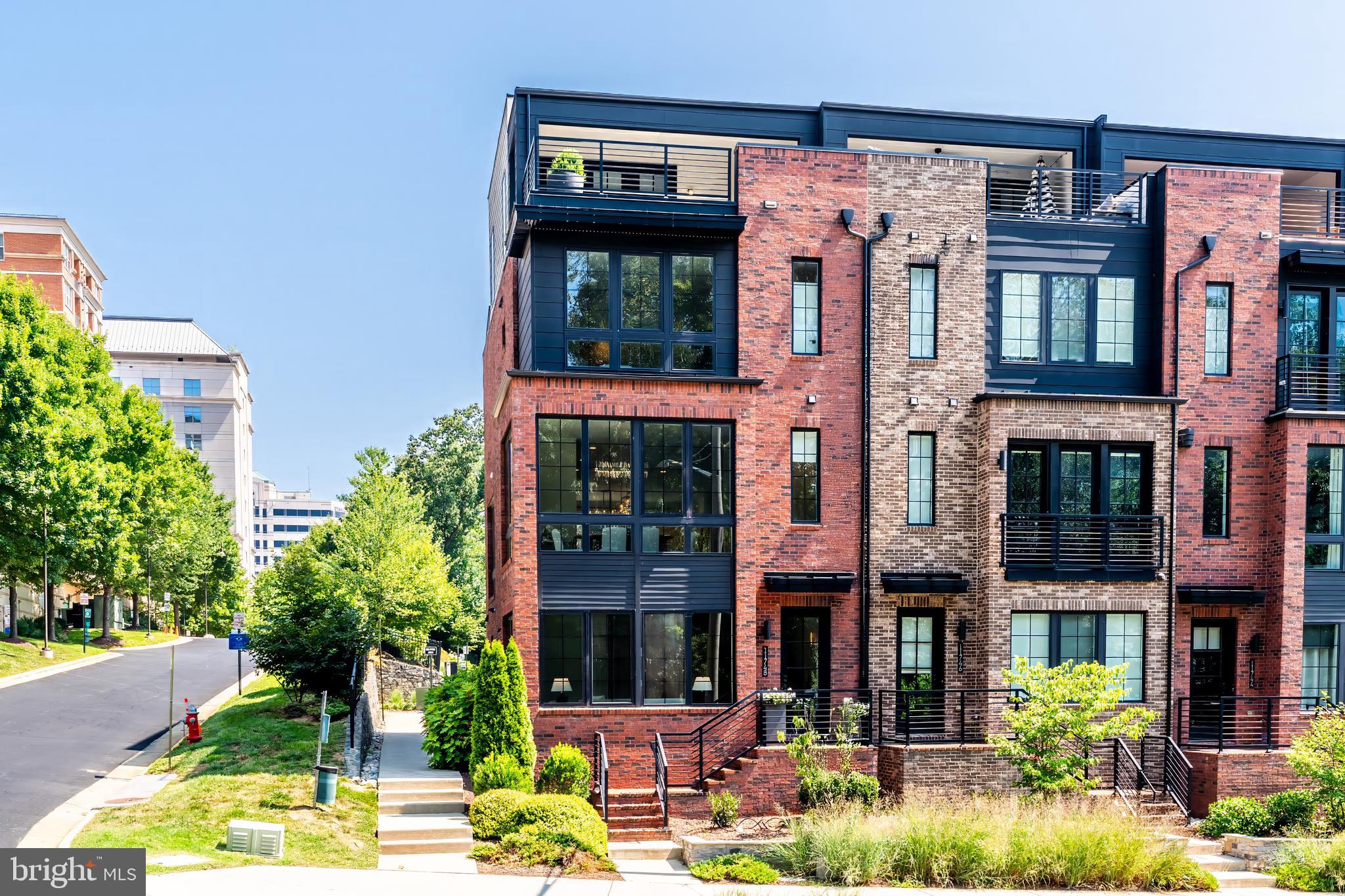 front view of a building with a garden