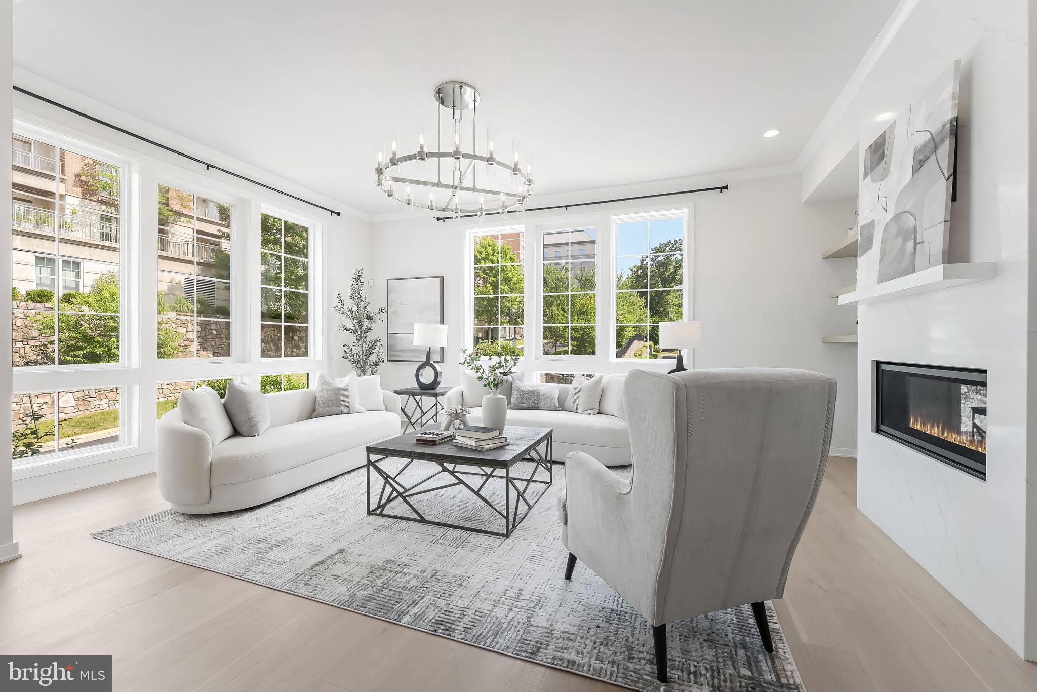 11748 Sunrise Valley Drive Reston, VA 20191 - Photo 13 of 60 a living room with furniture and a chandelier