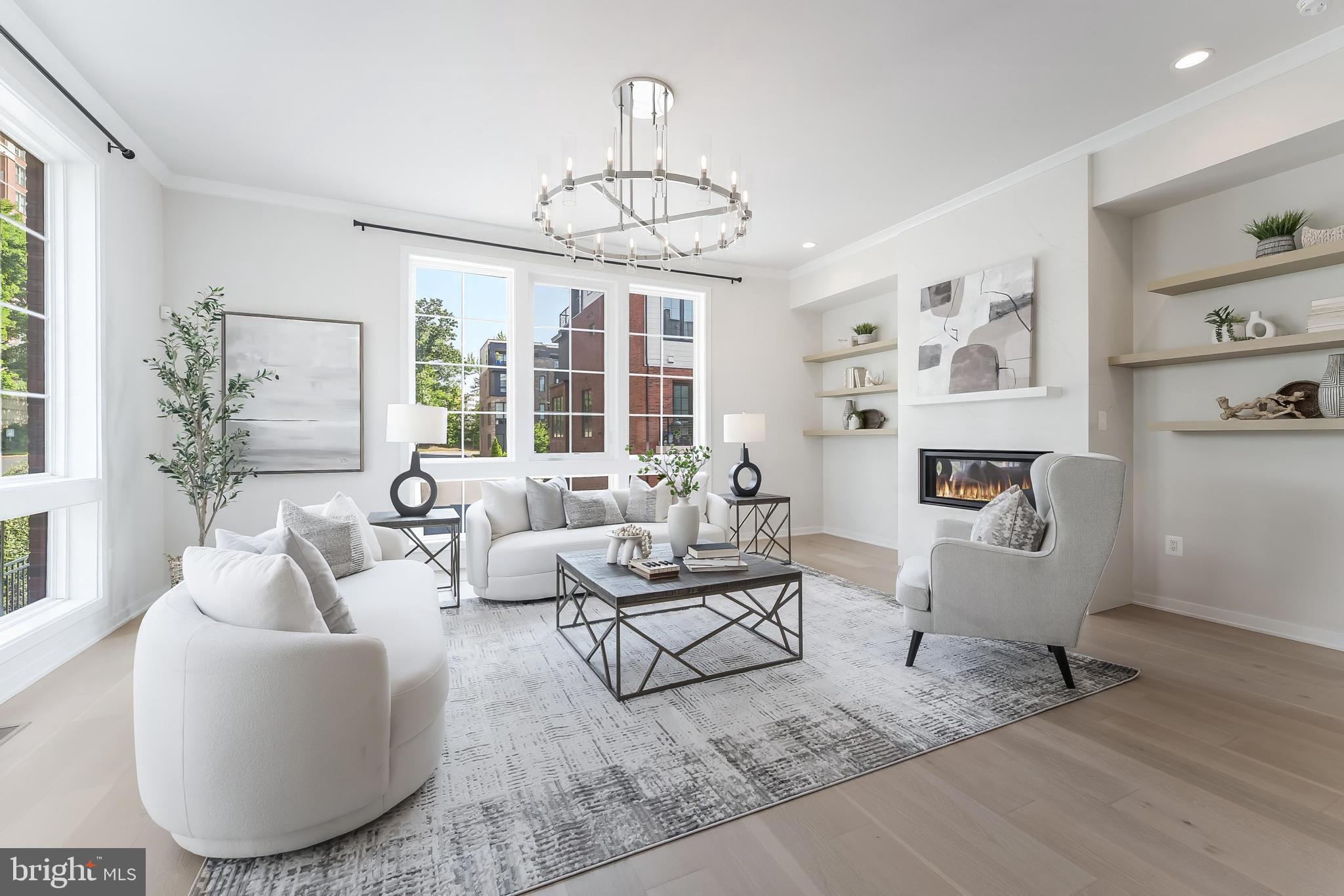11748 Sunrise Valley Drive Reston, VA 20191 - Photo 14 of 60 a living room with furniture and a chandelier
