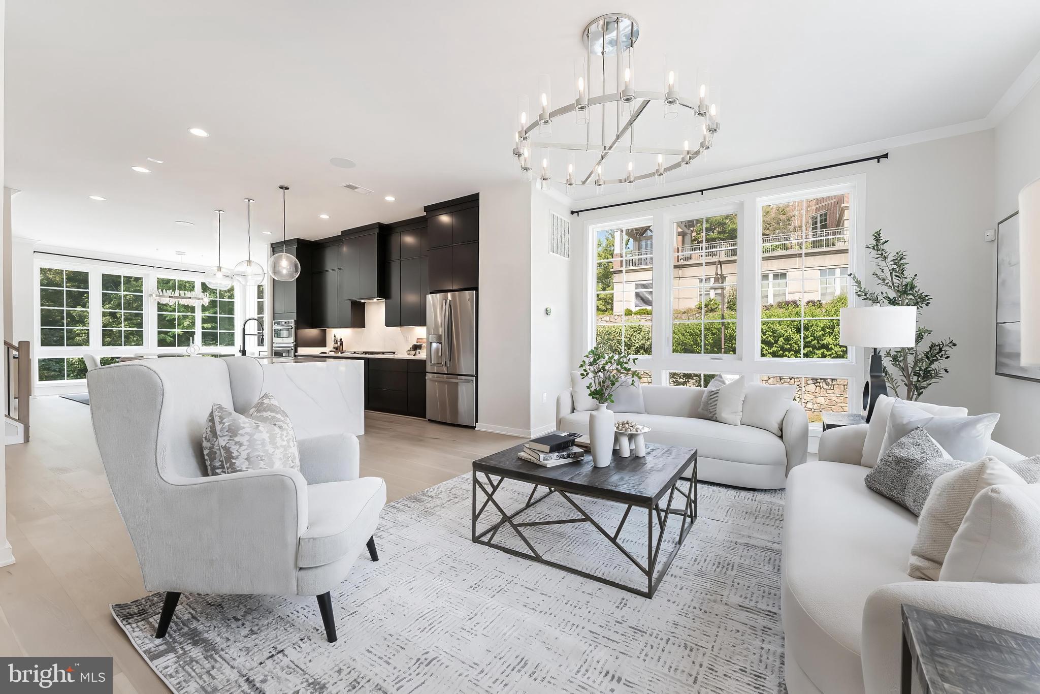 11748 Sunrise Valley Drive Reston, VA 20191 - Photo 16 of 60 a living room with furniture dining table and a chandelier