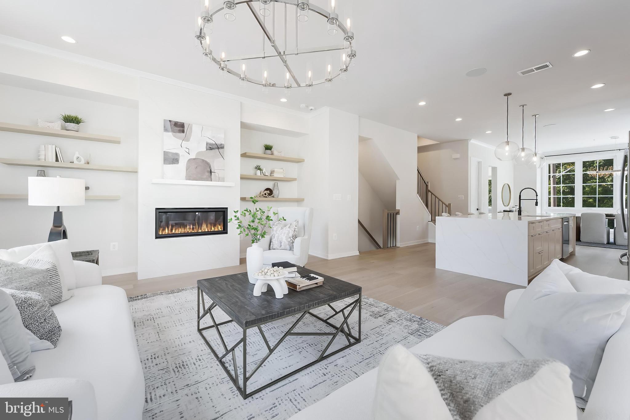 11748 Sunrise Valley Drive Reston, VA 20191 - Photo 17 of 60 a living room with furniture and a fireplace
