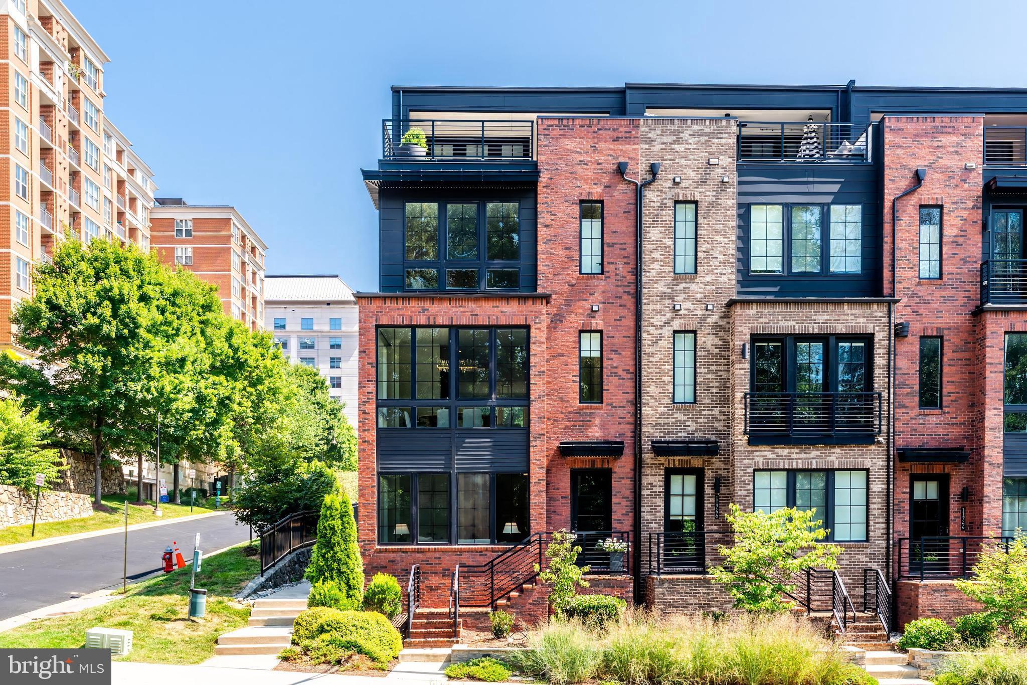 11748 Sunrise Valley Drive Reston, VA 20191 - Photo 2 of 60 front view of a building with a garden