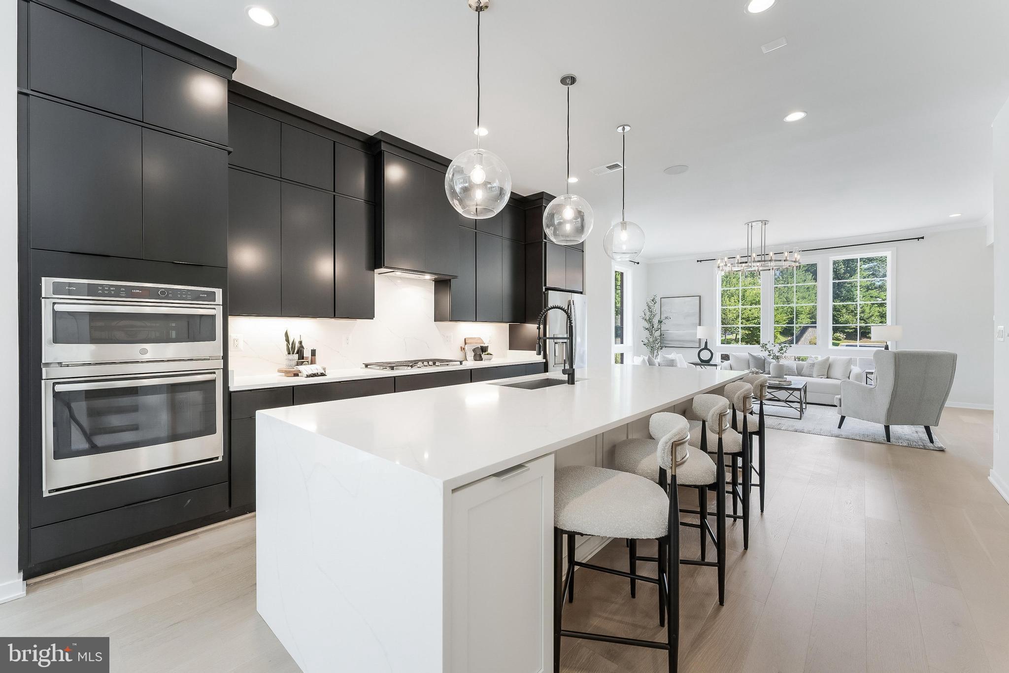 11748 Sunrise Valley Drive Reston, VA 20191 - Photo 21 of 60 a large kitchen with a table and chairs