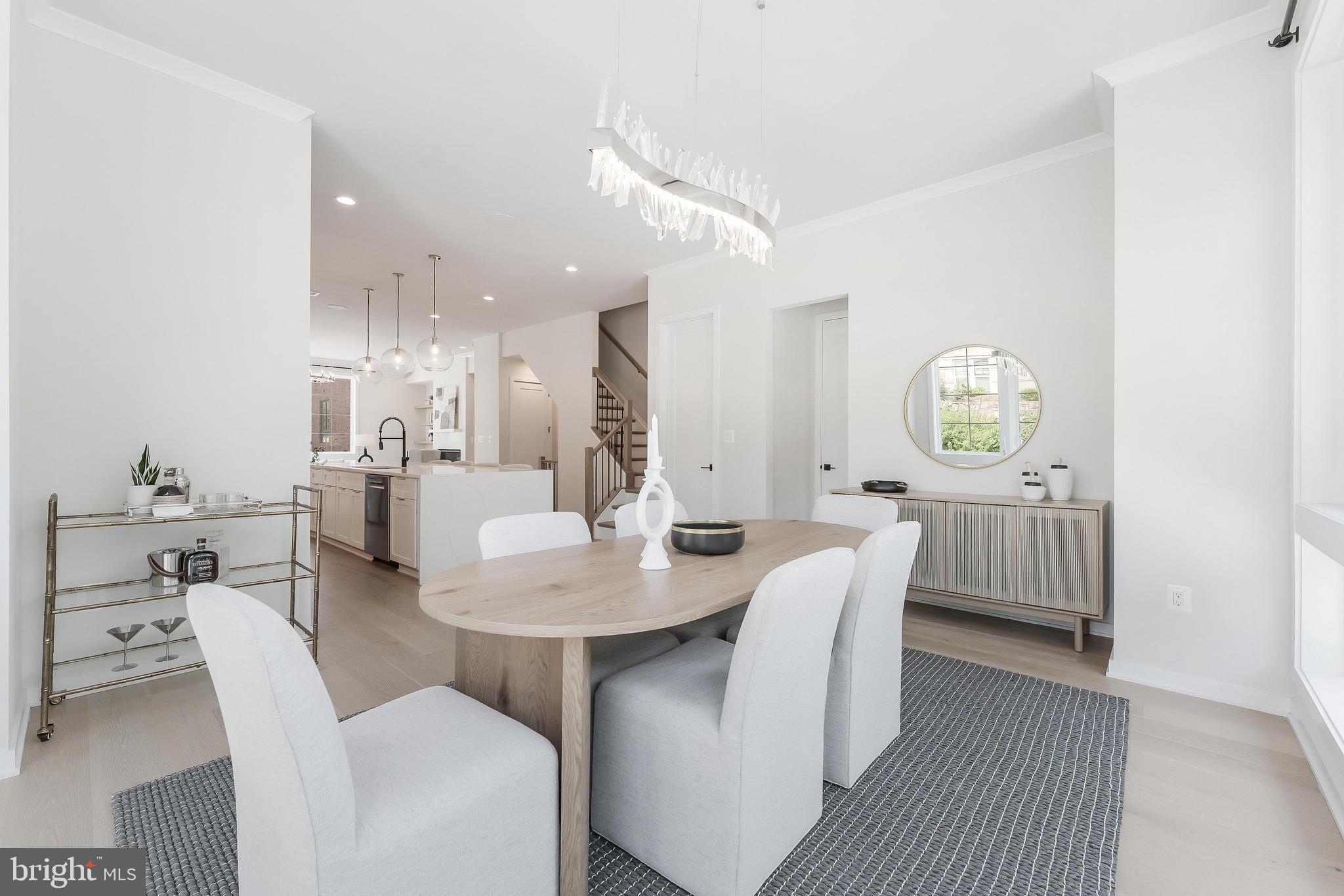 11748 Sunrise Valley Drive Reston, VA 20191 - Photo 23 of 60 a dining room with furniture and chandelier