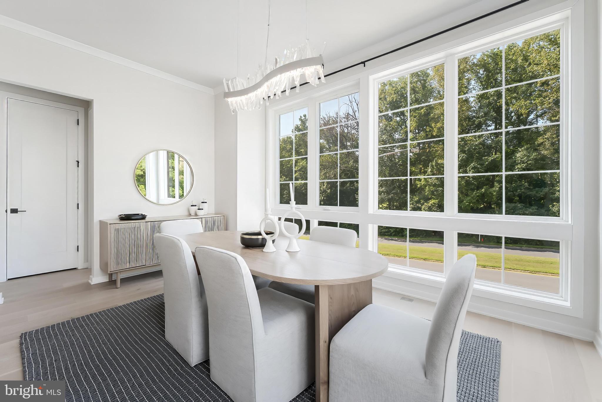 11748 Sunrise Valley Drive Reston, VA 20191 - Photo 24 of 60 a view of a dining room with furniture a rug and wooden floor