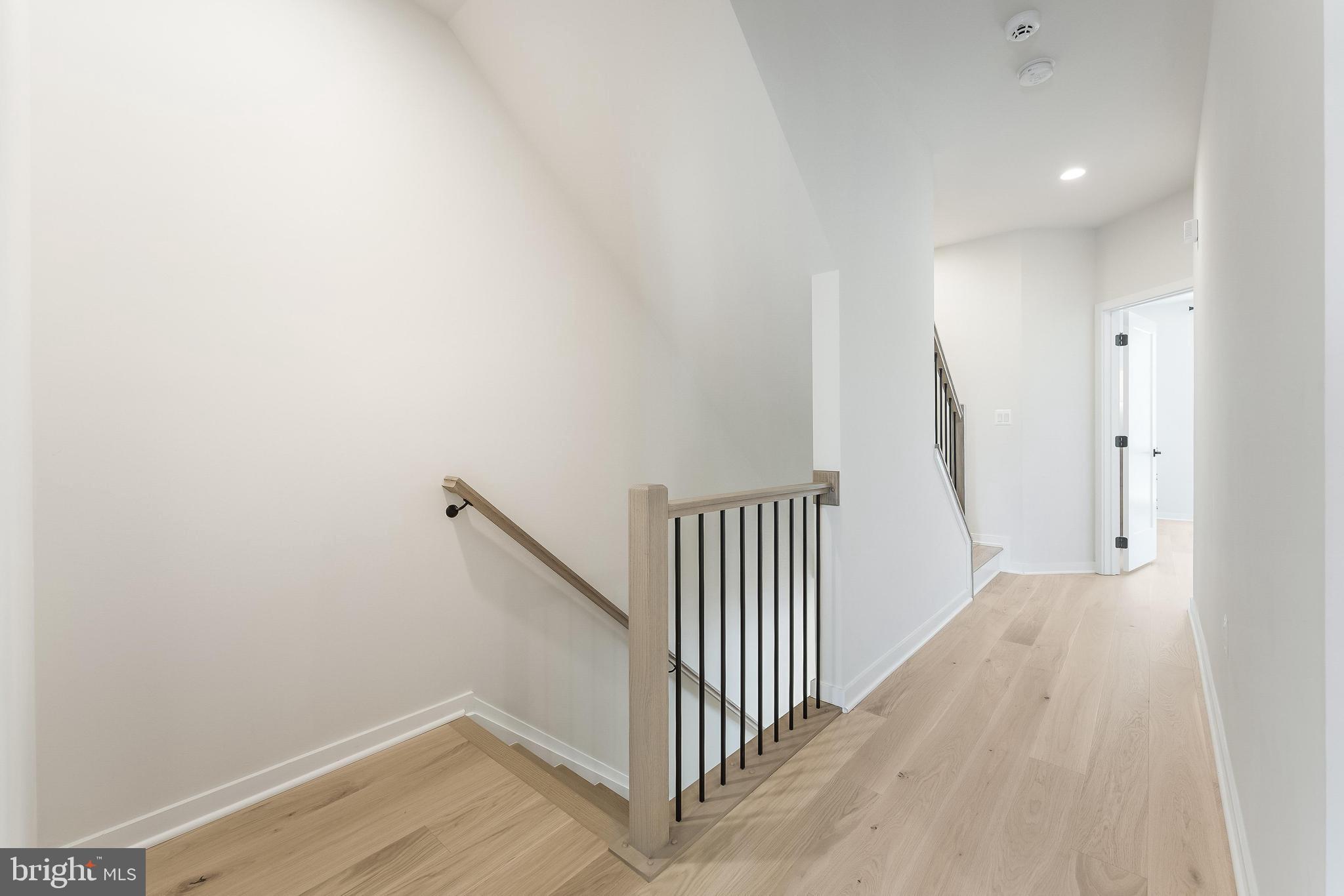 11748 Sunrise Valley Drive Reston, VA 20191 - Photo 27 of 60 a view of a hallway with wooden floor