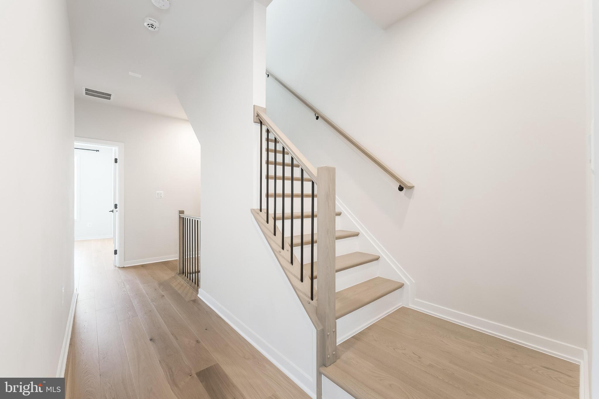 11748 Sunrise Valley Drive Reston, VA 20191 - Photo 28 of 60 a view of entryway and hall with wooden floor