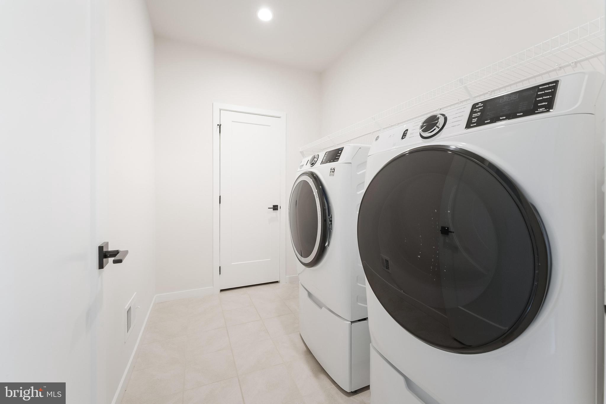 11748 Sunrise Valley Drive Reston, VA 20191 - Photo 29 of 60 a utility room with dryer and washer