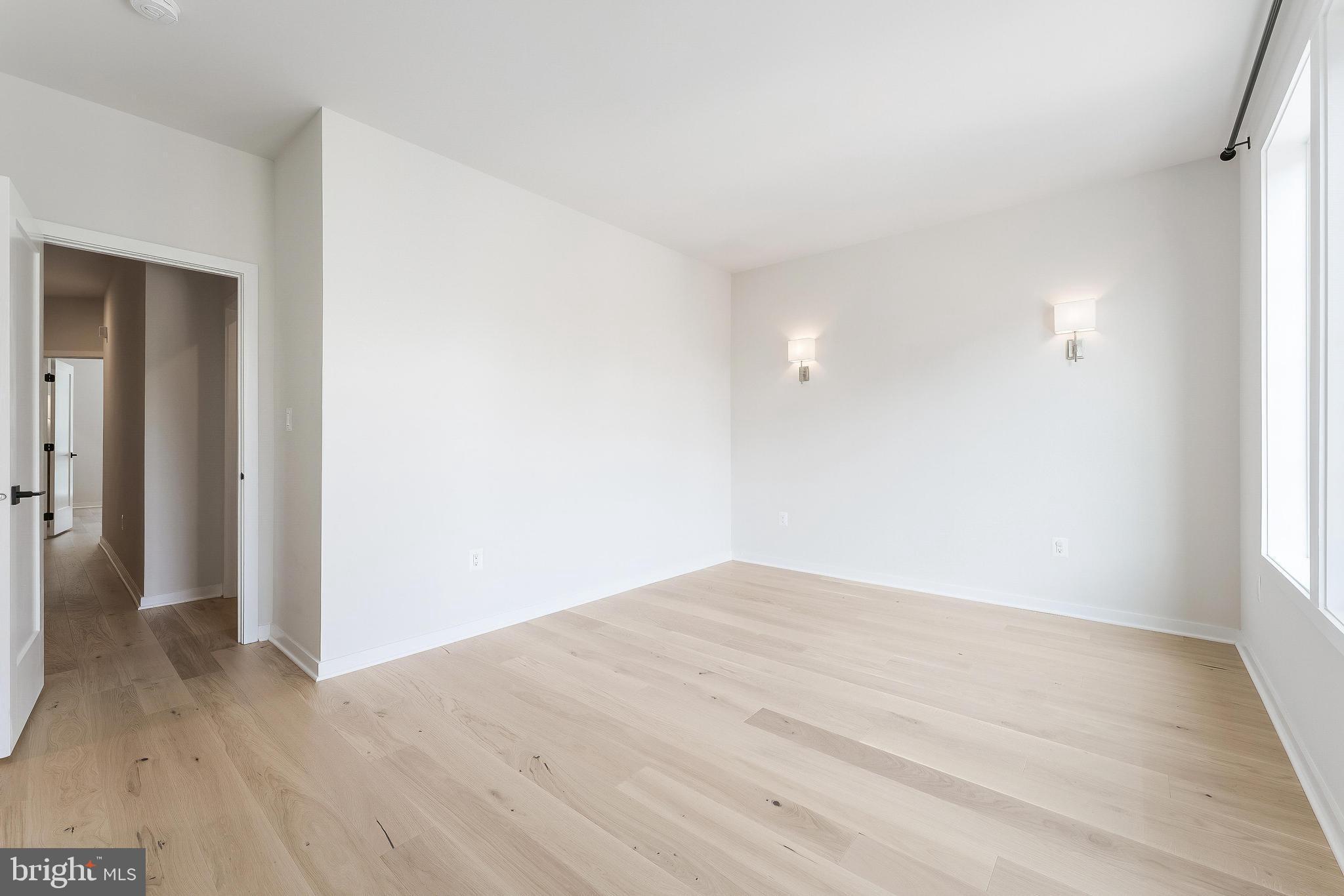 11748 Sunrise Valley Drive Reston, VA 20191 - Photo 31 of 60 a view of empty room with wooden floor