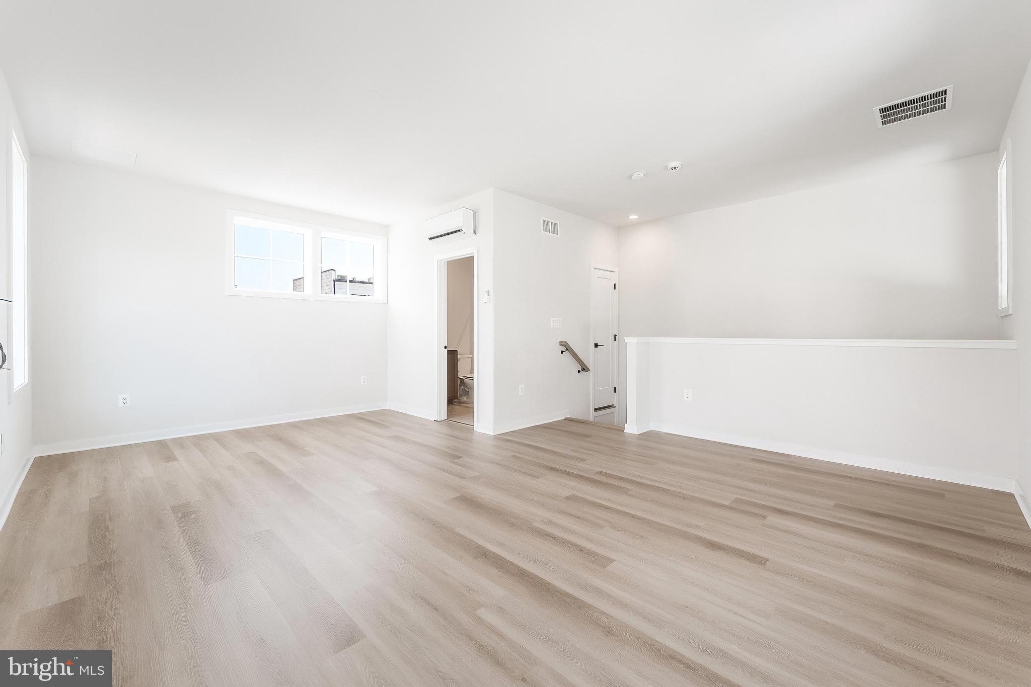 11748 Sunrise Valley Drive Reston, VA 20191 - Photo 46 of 60 a view of empty room with wooden floor