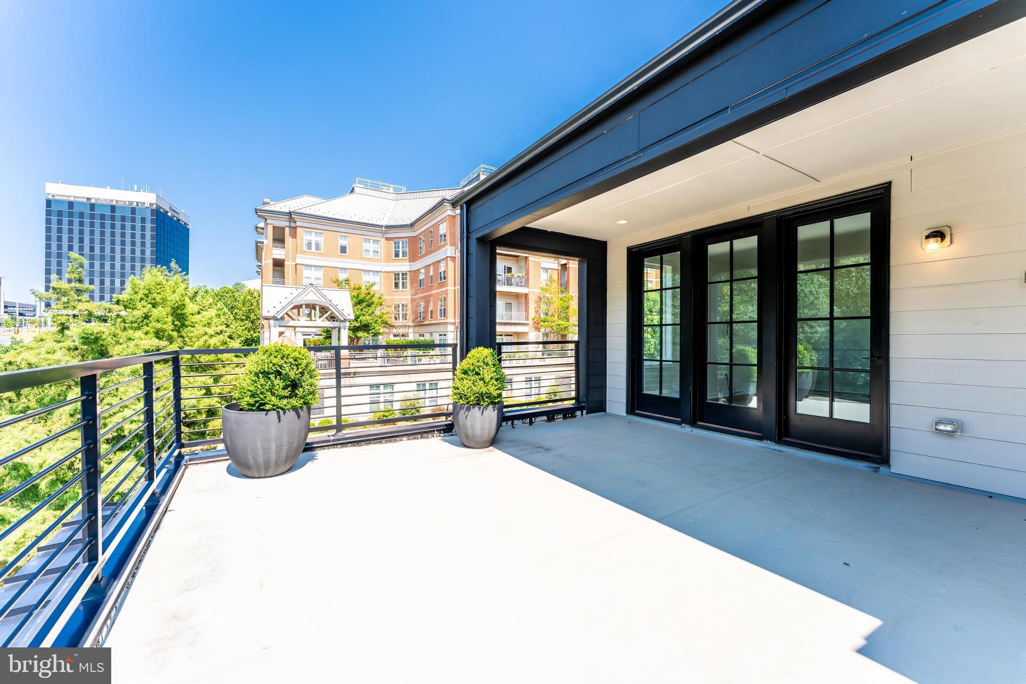 11748 Sunrise Valley Drive Reston, VA 20191 - Photo 52 of 60 a view of a porch and garden