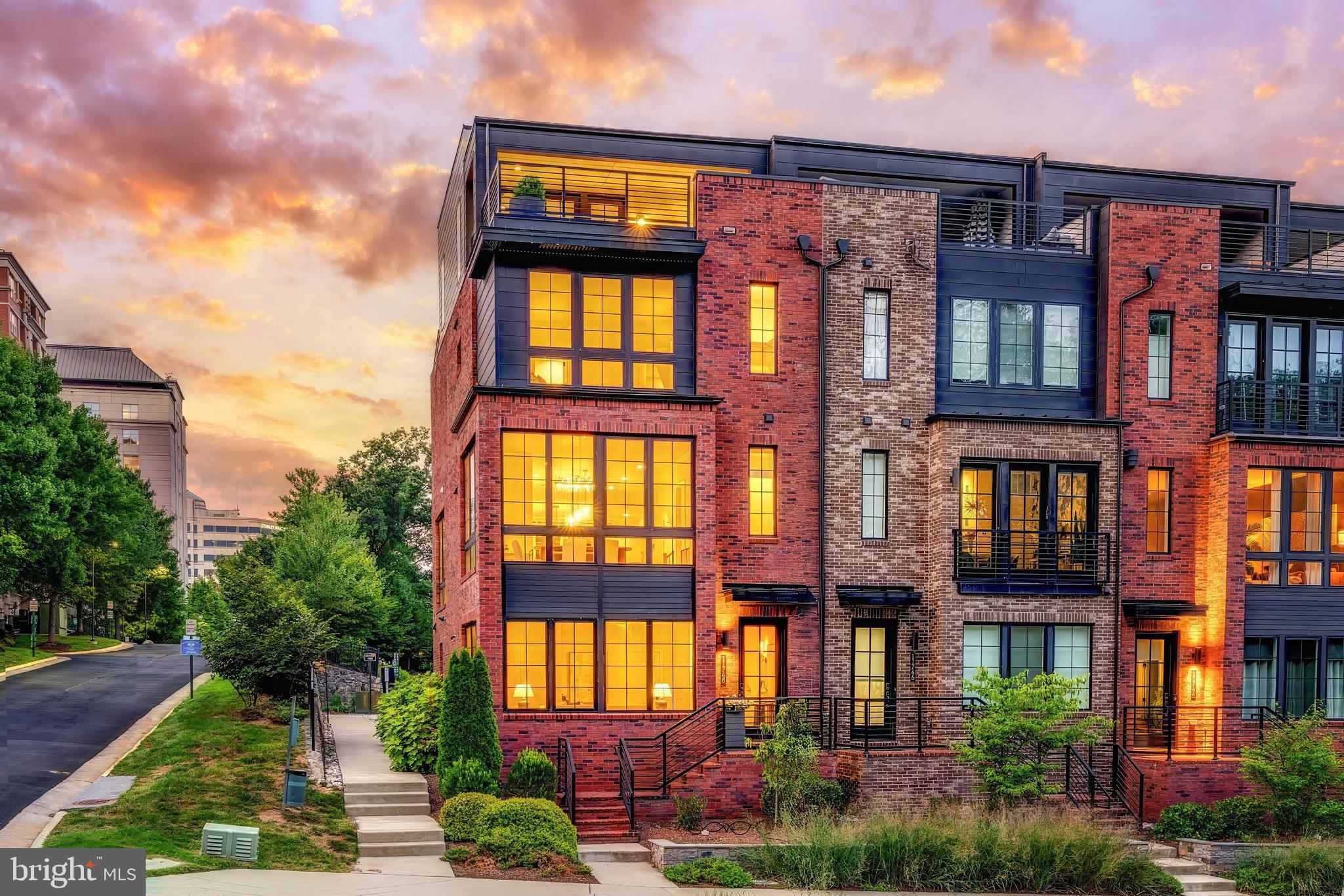 11748 Sunrise Valley Drive Reston, VA 20191 - Photo 57 of 60 a front view of a residential apartment building with a yard