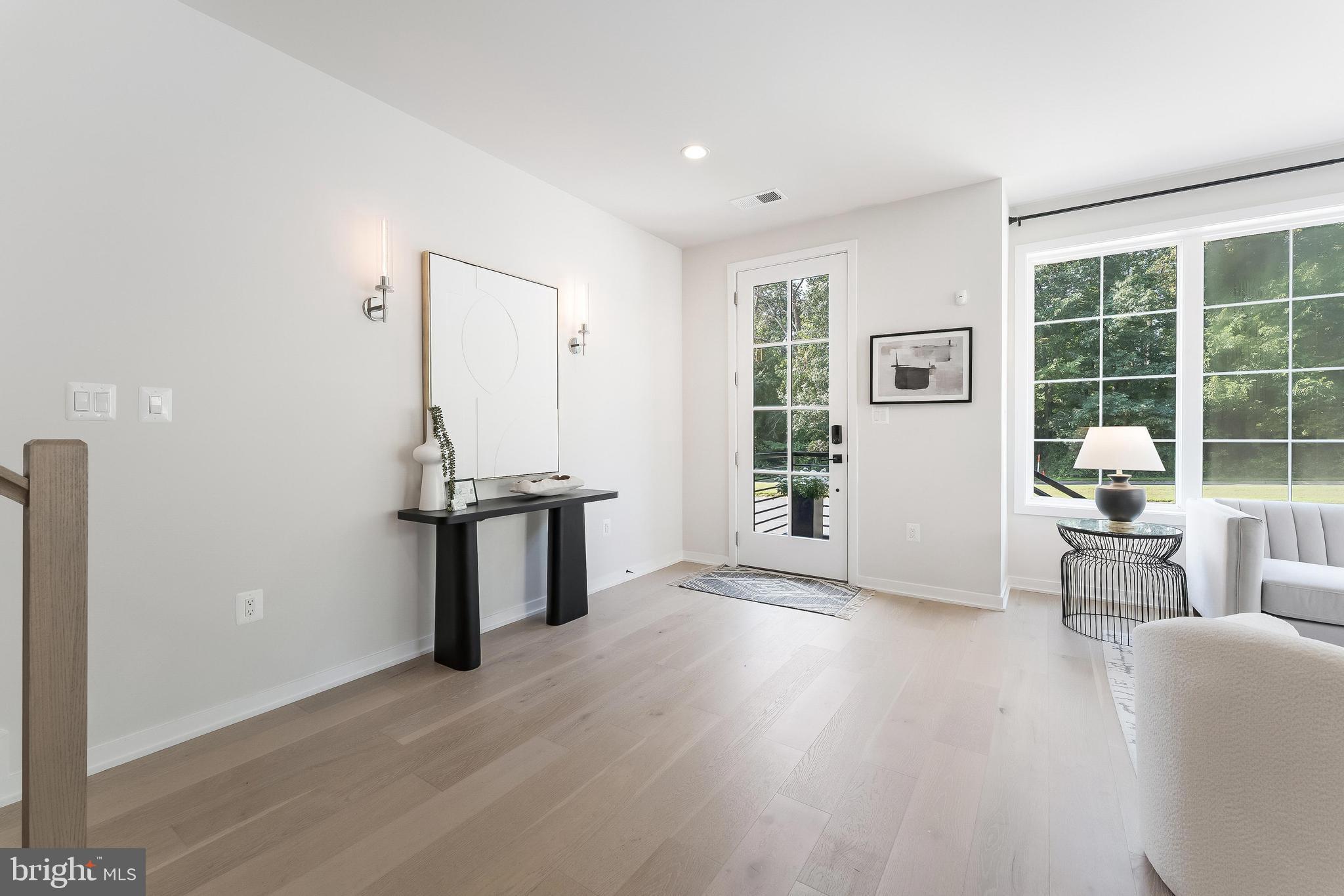 11748 Sunrise Valley Drive Reston, VA 20191 - Photo 6 of 60 a view of a livingroom with furniture and a window