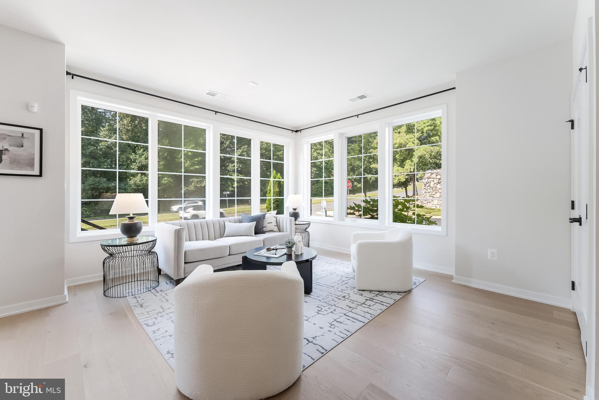 11748 Sunrise Valley Drive Reston, VA 20191 - Photo 7 of 60 a living room with furniture and large windows